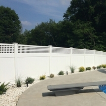 pool with white vinyl fence